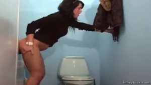 Wild teen sucking a dick through a gloryhole