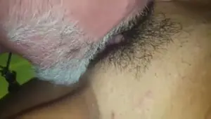 Bearded guy mouths a hairy pussy
