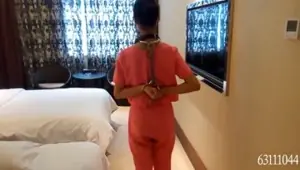 Tied up Chinese sex slave sitting in a closet