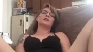 Shaved amateur fingers her own twat