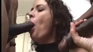 Nasty brunette gets stabbed by two long black dicks