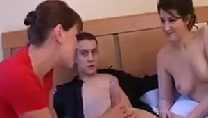 Boot clad British cougar having sex with a younger guy and girl