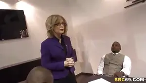 MILF Nina Hartly takes two black cocks at the office