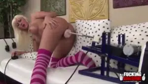 Horny blonde plays with her sex machine