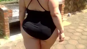 BBW in stockings and body suit doing a quick outside strip