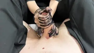 Mistress in Gloves Dominates Guy with Footjob in Nylon Socks